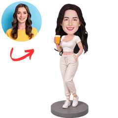 Woman in White Outfit Holding Orange Drink Custom Bobblehead